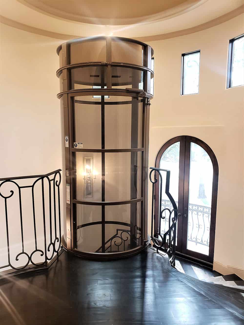 top landing of a PVE52 3-person wheelchair elevator installed in a home in The Woodlands Texas