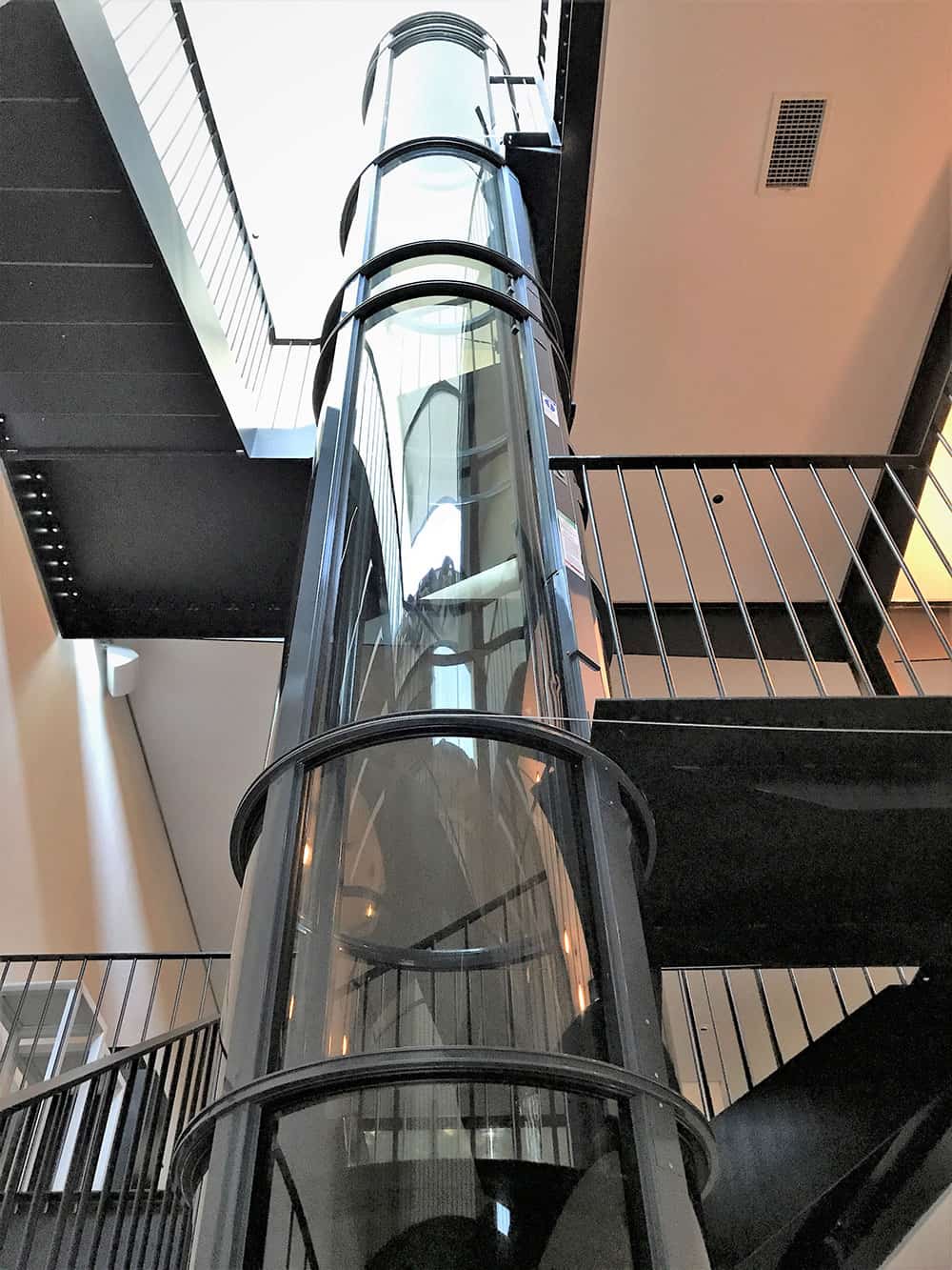 3-story residential elevator installed in the stairwell of a westlake residence