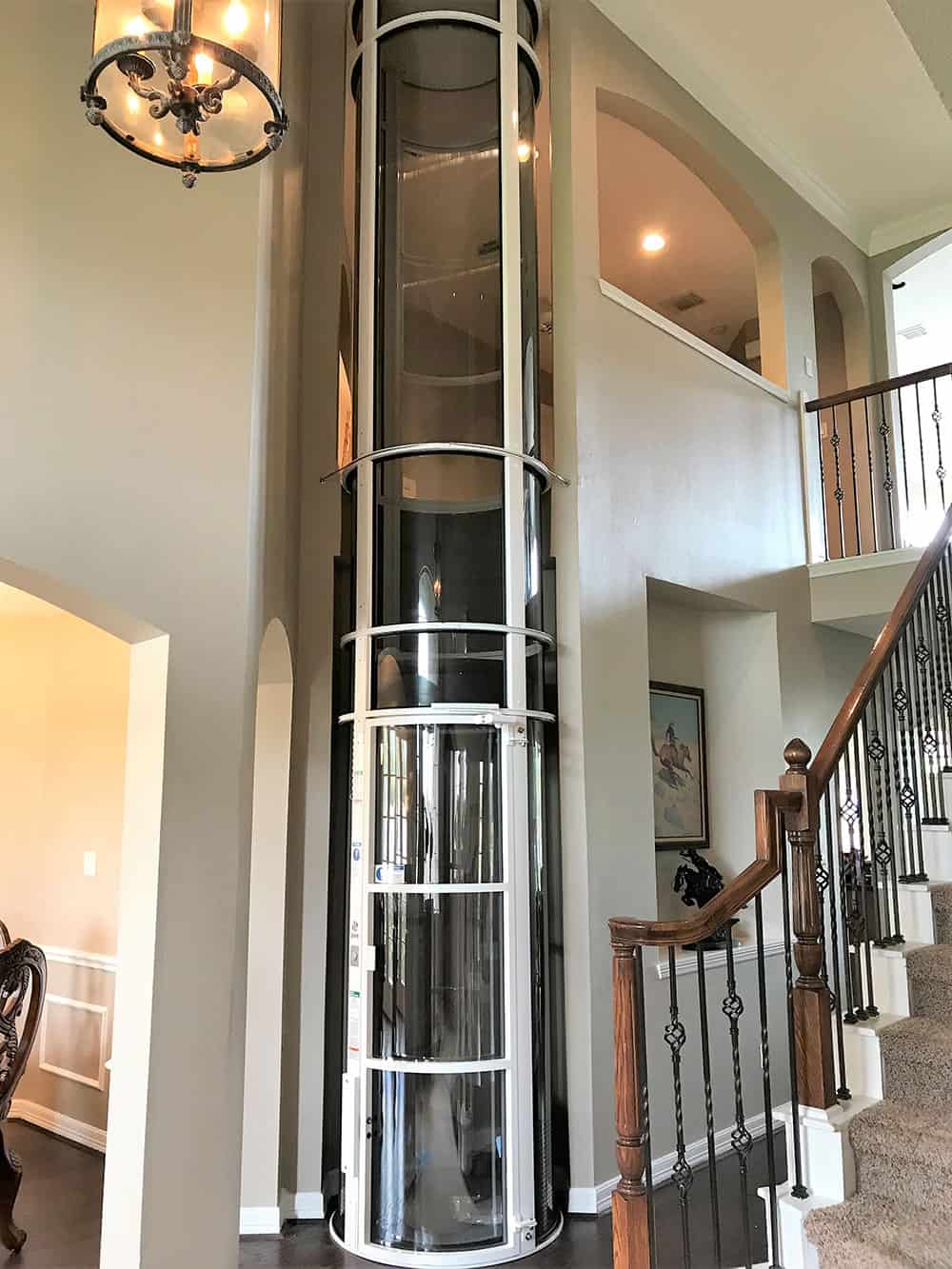 white pve elevator instllaed in a small alcove of a Cypress Texas home