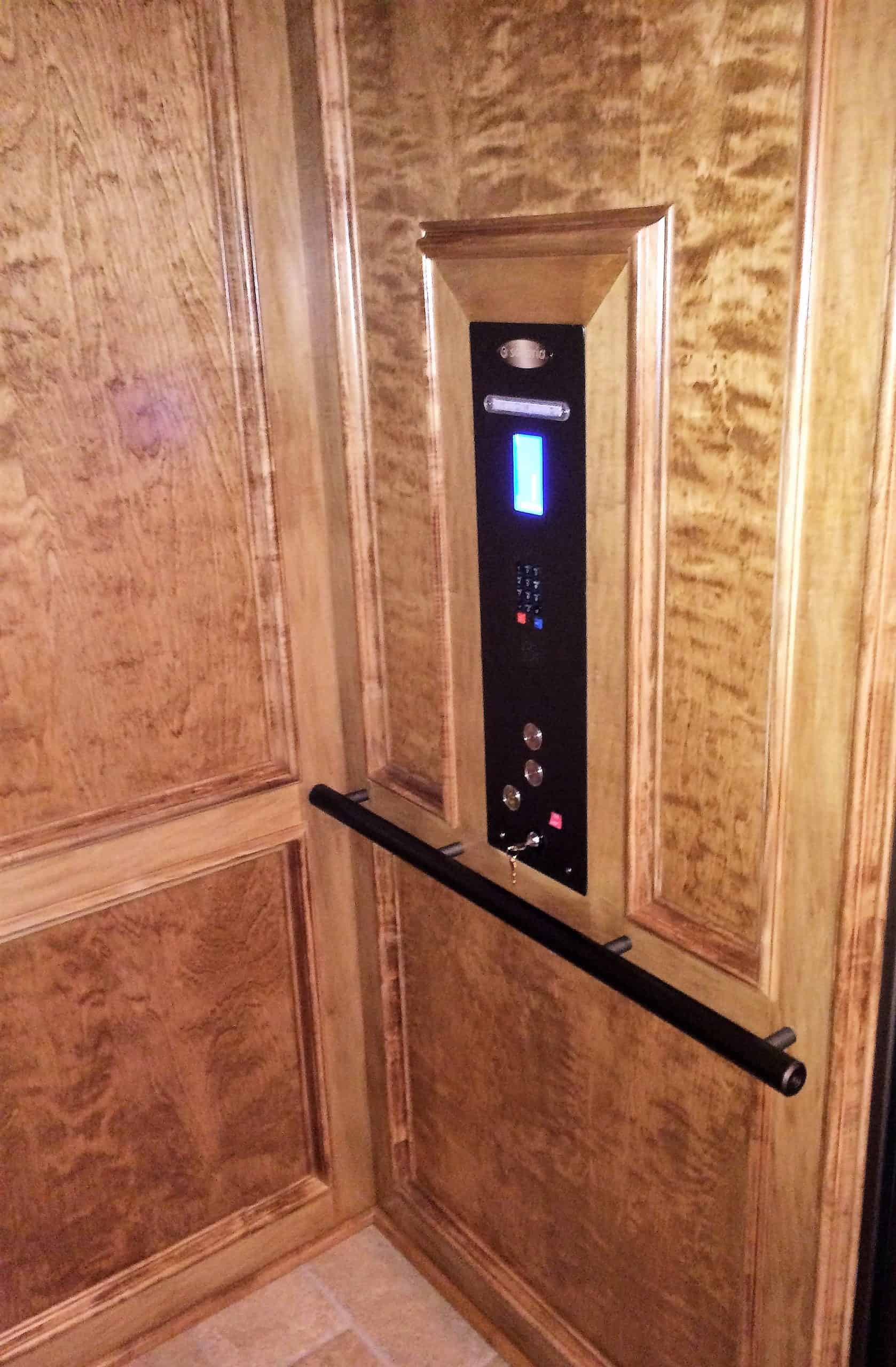 custom oak panels in a residential elevator