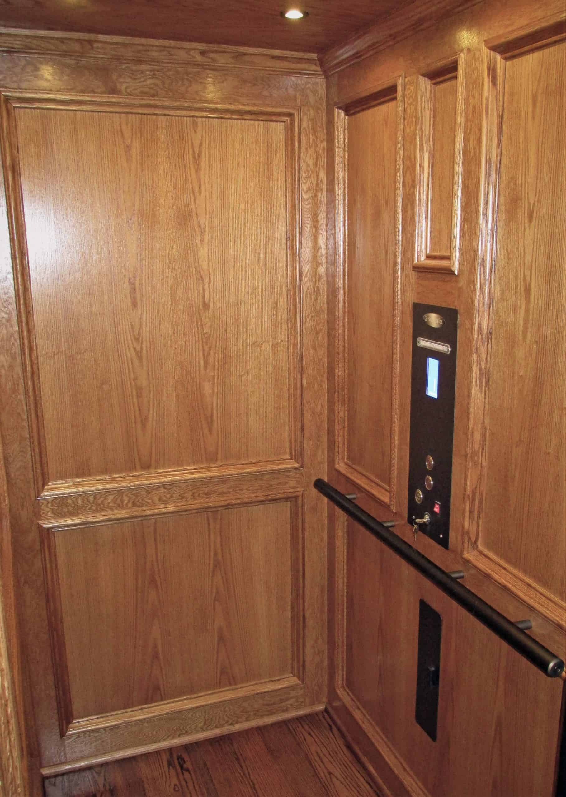 custom wood paneled residential elevator cab