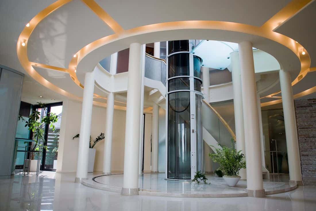 pve vacuum elevator with a white finished frame in a luxurious stairwell of a luxury home